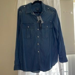 An oversized Boyfriend Style Express Jean Shirt. The shiny buttons make it pop!